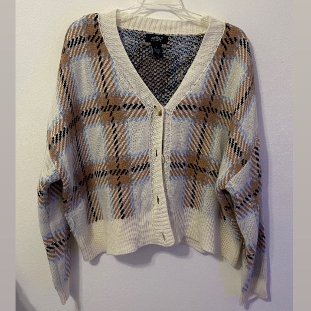 white, brown, blue, and black cardigan